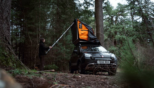 Person setting up TentBox Lite roof tent in 5 minutes